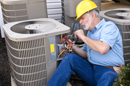 Repair man fixing AC